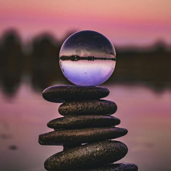 A serene landscape with stacked stones symbolizing balance.